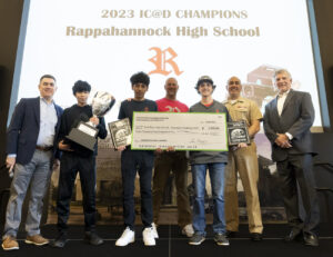 Naval Surface Warfare Center Dahlgren Division’s Technical Director Dale Sisson Jr., SES, Commanding Officer Capt. Philip Mlynarski and University of Mary Washington’s Dr. John Burrow (left) pose with this year’s High School Innovation Challenge @ Dahlgren championship team from Rappahannock High School. Ricardo Alvarez (second from left), Michael Martinez and Cain Edwards, with assistance from physics teacher Preston Ailor, won the competition by remotely controlling their robot through the course.