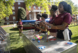 Balloon Blast was among the inflatable-type competitions covering Jefferson Square for Devil-Goat Day. Photo by Tom Rothenberg.