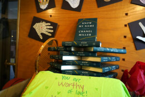 The Title IX exhibit in Simpson Library features memorabilia from annual campus events designed to increase awareness of sexual abuse and violence. The handprints in this portion of the two-part display represent the 'I Can Project,' and the T-shirt represents the 'Clothesline Project,' both of which allow survivors and participants to share thoughts and encouragement. Photo by Suzanne Carr Rossi.