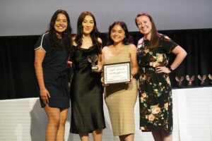 The Latino Student Association club officers pose with Student Activities and Engagement Director Sandrine Sutphin (far right). The club won the Outstanding Annual Program Award for their Latino Identities Month Kick-off Event. Photo by Suzanne Carr Rossi.