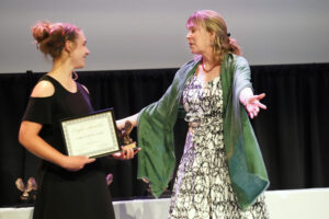 Center for Community Engagement Director Sarah Dewees presented the Leader in Service Award to Kylie Jackson. Photo by Suzanne Carr Rossi.