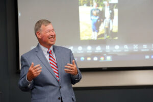 Leigh Frackelton, who taught at Mary Washington for 35 years, shares a few stories of his own in the Woodard Hall classroom named for him. Photo by Suzanne Carr Rossi.