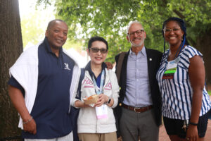 President Troy Paino and Associate Vice President and Dean of Student Life Emeritus Cedric Rucker '81 pose for a photo with alums outside George Washington Hall in 2022. Dr. Paino and wife Kelly will host a welcome reception for alums at Brompton on Thursday and Friday. Photo by Karen Pearlman Photography.