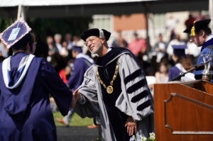 UMW President Troy D. Paino shakes hands during Commencement. Photo by Suzanne Carr Rossi.