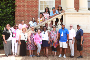 The Black Alumni Affinity Group poses for a picture with President Troy Paino and Associate Vice President and Dean of Student Life Emeritus Cedric Rucker on the Jefferson Hall steps. Photo by Karen Pearlman Photography.
