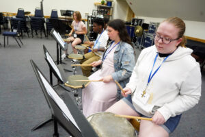 From front to back: High-schoolers Maggie Farran, Abby Dye, Michael Wilder and Olivia Carey participate in a course called "Drumroll Please! An Introduction to Percussion" taught by Adjunct Professor of Percussion Matt Case during the Summer Enhancement Program at UMW. Photo by Suzanne Carr Rossi.