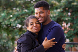 mom and son hugging during move-in day at university of mary washington