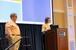 Director of Transfer Advising Charles Tate (left) and Simpson Library Records Coordinator Sarah Appleby take turns announcing award recipients in the Chandler Ballroom. Photo by Sam Cahill.