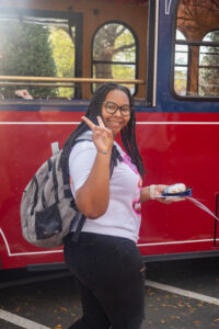 UMW student Alanah Cleare prepares to board a trolley for a free ride to cast her vote. Photo by Sam Cahill.