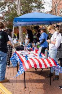 Student volunteers manned tables near the Bell Tower, handing out information and helping students grab free rides to the polls. Photo by Sam Cahill.