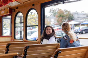 Tonia Attie, co-president and founder of UMW’s chapter of Day on Democracy, takes a free trolley ride to the poles during the Day on Democracy event at UMW. Photo by Sam Cahill.