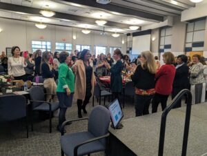 Susan Coleman (center) is congratulated by former Big Brothers Big Sisters Greater Fredericksburg Executive Director Michelle Hedrich (left) and UMW Executive Director of Human Resources Beth Williams (right).