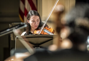 UMW student Claudia Boyd rehearses for the 'Two Roads Diverged' concert, to be held at UMW on Sunday, Nov. 12. Photo by Tom Rothenberg.