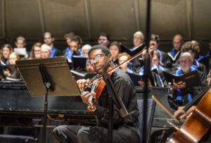 UMW student Cornellius Ellis rehearses for the Two Roads Diverged concert, to be held at UMW on Sunday, Nov. 12. Photo by Tom Rothenberg.