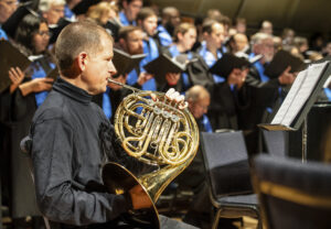 Professor and Chair of the Department of Music J. Brooks Kuykendall will play horn in the chamber orchestra and accompany the choir on organ during Sunday's concert. Photo by Tom Rothenberg.