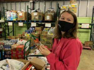 Meghan McLees '23 volunteers her time and efforts at the local food bank. The UMW alumna donated more than 100 service hours last year alone.