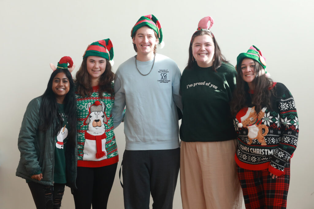 From left to right, UMW COAR staff members, Kushi Constance, a senior marketing major who is staff director; Ainsley Lord, a sophomore environmental science major who's in charge of special projects; Knox McKinley, a sophomore sociology and women's and gender double major who's an intern mentor; Sarah Hybl, a junior English major who is studying secondary education and serves as council liaison; and Jillian Vargas, a sophomore international relations major who handles social media. Photo by Karen Pearlman.