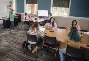 Melissa Wells (far left) on the job teaching future educators at UMW's College of Education.