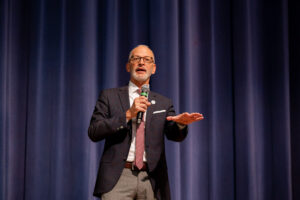 University of Mary Washington President Troy Paino delivers the spring 2024 opening-semester address to faculty and staff inside UMW's Dodd Auditorium. Photo by Sam Cahill.