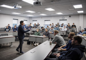 Jin Wong speaks to the UMW baseball team in the Leigh Frackleton Classroom in the College of Business. Wong was a Division-III All-American outfielder on the team in college. Photo by Tom Rothenberg.