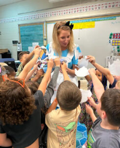 Ritchie completes 'A Cup of Kindness' lesson with an 'Alice in Numberland' tea party theme. First-graders practiced filling each other's decorated teacups with positive words, and chose to fill Ritchie's cup, as well, at the end of the exercise.