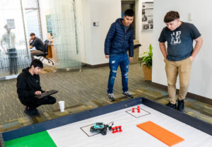 Members of the Rappahannock High School team work to defend the championship title they earned in last year's High School Innovation Challenge @ Dahlgren. In the end, they were edged out by a King George High School team. Photo by Dave Ellis.