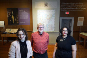 UMW senior Brooke Prevedel (left), Professor of Geography Steve Hanna and Fredericksburg Area Museum (FAM) Curator of African American History and Special Projects Gaila Sims pose at FAM's new exhibit, 'Lafayette’s World: Revolutionary Ideals and the Limits of Freedom.' Prevedel and Hanna spent more than 100 hours creating a map of Lafayette's 1824 journey through the U.S. and making sure it had the right look and feel for the exhibit. Photo by Suzanne Carr Rossi.