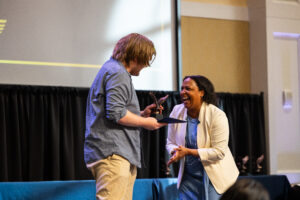 Dean Jones shared a laugh with Events AV team member Cameron, who accepted the In the Wings Award on behalf of Events AV. “Without this group of people, frankly most of the events that we have talked about tonight simply would not have happened,” Jones said. Photo by Sam Cahill