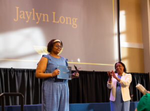 Dean of Students Melissa Jones (right) presents the prestigious Grace Mann Launch Award to senior Jaylyn Long. Last week's Eagle Awards ceremony recognized students and other members of the University community for their commitment to citizenship, philanthropy, academic excellence, community service and more. Photo by Sam Cahill