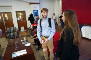Business students Jenna Diehl and Brian Gaydos talk before the competition begins. The two won the judges' favor, capturing prize money of $3,500 to split. Photo by Suzanne Carr Rossi.