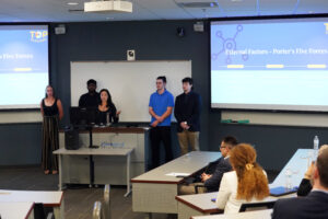 From left to right: UMW students Emily Beckner, Rushil Irfan, Amanda Hagino, Gregory Keehan, and Brendan Pacious present during last week's Case Competition. The team won third place, earning $500. Photo by Suzanne Carr Rossi.