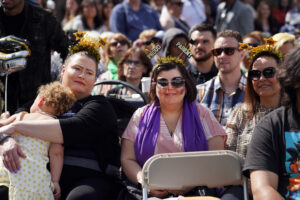 Friends and family gathered on the University of Mary Washington’s Fredericksburg campus to cheer on the 2024 graduates. Photo by Suzanne Carr Rossi.