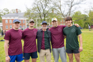 UMW President Troy Paino poses with students in his custom made half-Devils/half-Goats T-shirt. Photo by Parker Michels-Boyce.