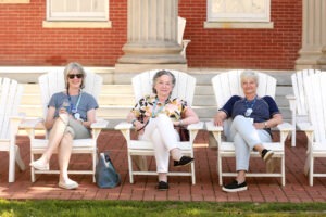 1974 alumnae sit for a spell on the Adirondack chairs on Ball Circle. Ball Hall served as housing for dozens of alumni during Reunion Weekend. Photo by Karen Pearlman.