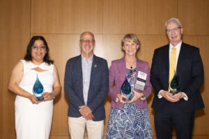 2024 Alumni Award recipients Simran Kaur-Colbert '11, Susan Leavitt '83 and Jay Dugger '90 with President Troy Paino at UMW's Alumni Awards ceremony on June 1 during Reunion Weekend. Photo by Karen Pearlman.