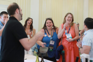 Class of 2014 graduates, including Danielle DeSimone (right) and Shelby Orlando (center), enjoy the Virginia wine, beer and cider tasting at the Jepson Alumni Executive Center on Saturday. Photo by Karen Pearlman.