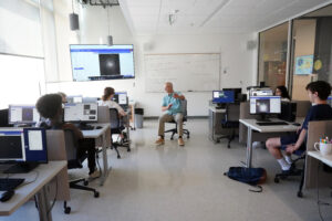 Students in Distance and Scale in Astronomy with Professor of Physics Matt Fleenor start their day with a view of the stars. Photo by Suzanne Carr Rossi.