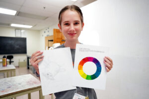 Cows and color wheels on display in The Science of Paint. Photo by Suzanne Carr Rossi.