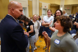 Robert Courtnage ’98 answers questions from current students during the Summer Science Institute alumni luncheon. Photo by Suzanne Carr Rossi.