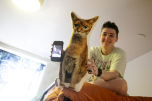 Alexandra Fisher of Loudoun County brought a memento from home - a pillow replica of her cat, Jack - to her new room in UMW's Randolph Hall. Photo by Karen Pearlman.