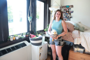 First-year UMW student Bryar Laine poses in her Virginia Hall room, where she's perched a line-up of succulents on the windowsill. Bryar is among 87 new UMW students in the Honors Program. Photo by Karen Pearlman.