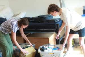 Mateo Pinover and his mother, Edwige, unpack his things in his new UMW residence hall. Mateo is considering majoring in theatre. Photo by Karen Pearlman.