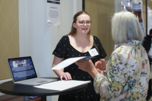 Amelia Bailey '26, one of the Scholarship Luncheon student speakers, shares her research on Catherine deMedici and marriage diplomacy with a donor. Bailey earned the Alumni Legacy, Oscar H. Darter, Barbara Diane Hall and Polly Updegraff Champ scholarships, among others. Photo by Karen Pearlman.