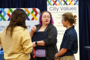 UMW senior Vivian Reinhardt, a communication and digital studies major, made the rounds at the recent Career and Internship Fair, taking advantage of the opportunity to introduce herself to a roomful of prospective employers. Photo by Suzanne Carr Rossi.