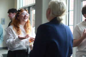 UMW student Maria Torres (left) talks during a break with Christine Goodwin '96, who served as a judge for the competition. Torres hopes to launch her service, EverBean, a vegan coffee cart for young adults. Photo by Karen Pearlman.