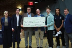 From left to right: Contest judge Christine Goodwin '96, UMW junior David Fitzgerald, judge Joel Griffin, judge Robby Noll ’88, UMW juniors Max McCusker and Themba Martin-Weiler, and judge Andrew Blate '04. The three students, all UMW men’s rugby team members, claimed third place in the Eagle Innovation StartUp Pitch Competition, winning $500 for Zip Rugby and their plan to launch high-quality uniform apparel. Photo by Karen Pearlman.