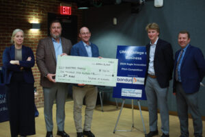 From left to right: Judges Christine Goodwin ’96, Joel Griffin and Robby Noll ’88 pose with second-place winner, UMW junior Joey Welsh, and the contest's fourth judge, Andrew Blate '04, during the Eagle Innovation StartUp Pitch Competition. Photo by Karen Pearlman.