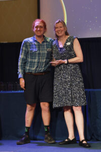 Center for Community Engagement Director Sarah Dewees presents UMW senior Max Steinbaum with the Elizabeth M. Baumgarten Service Award. Photo by Karen Pearlman.