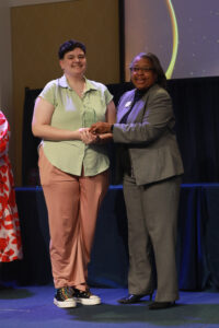 Assistant Vice President for Student Affairs and James Farmer Multicultural Center Director Marion Sanford (right) presents UMW senior Morgan Lewellen with the James Farmer Defining a Legacy Award. Photo by Karen Pearlman.