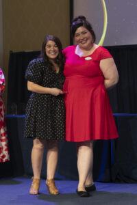 Center for Career and Professional Development Student Experience Manager Emily Burke (right) presents Assistant Director of Marketing and Social Media Manager Sam Cahill with the Life After Mary Washington Award for faculty and staff. Photo by Karen Pearlman.